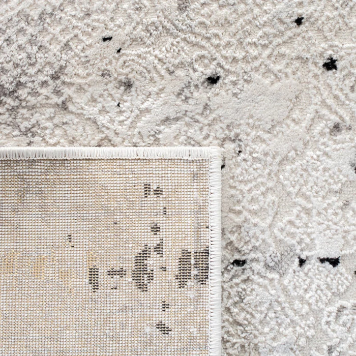 Close-up of the Acosta Rug in beige and gray, featuring abstract patterns, displaying both the front and back sides of the rug.