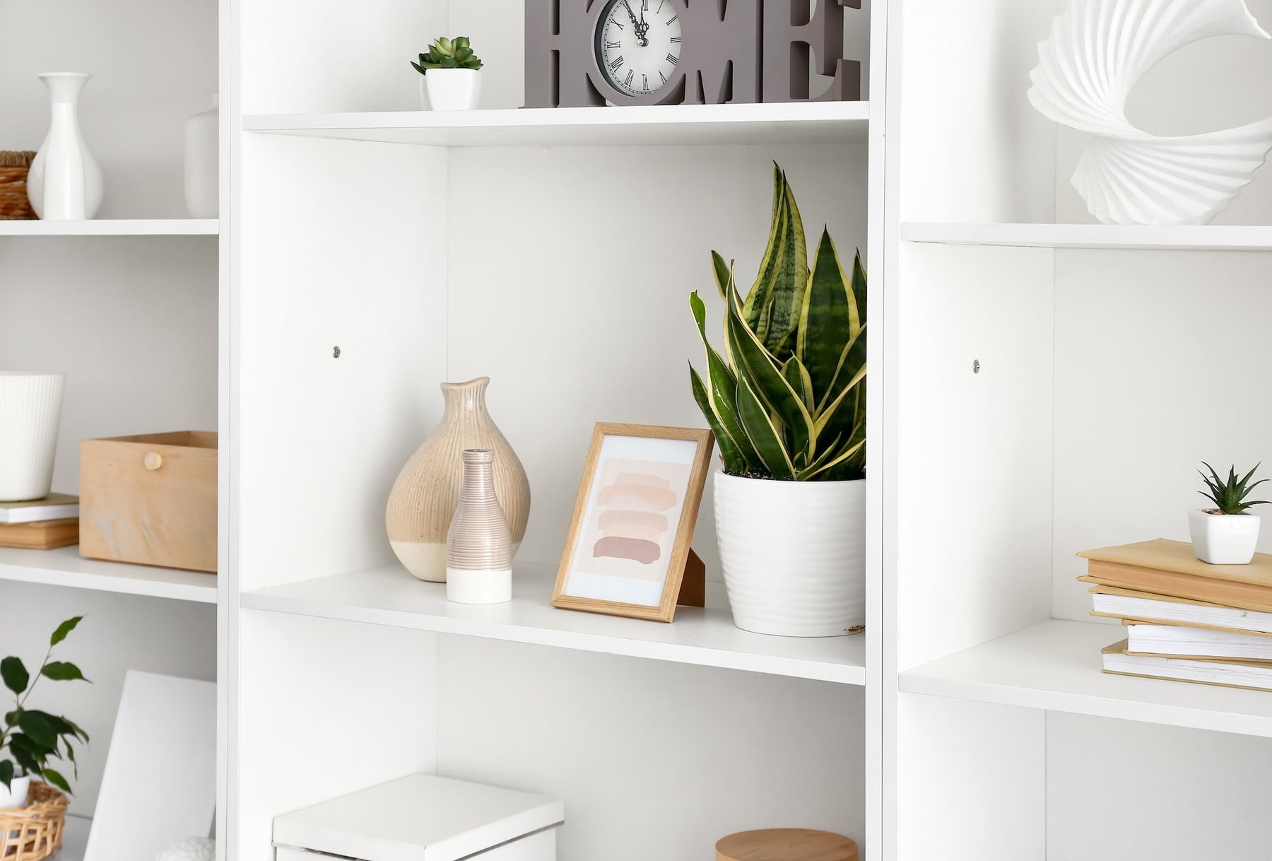 white bookshelf with various decorations