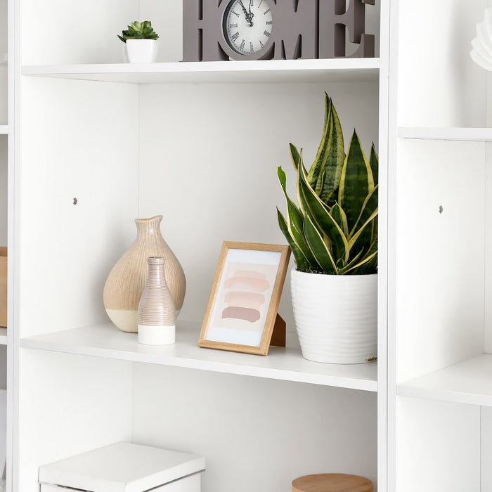 white bookshelf with various decorations