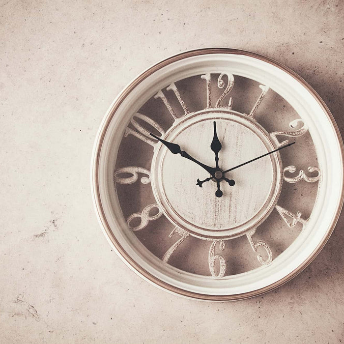 white vintage style clock on wall