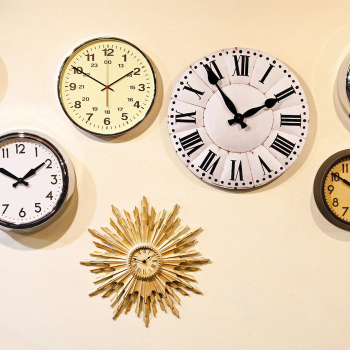 various types of retro clocks on wall