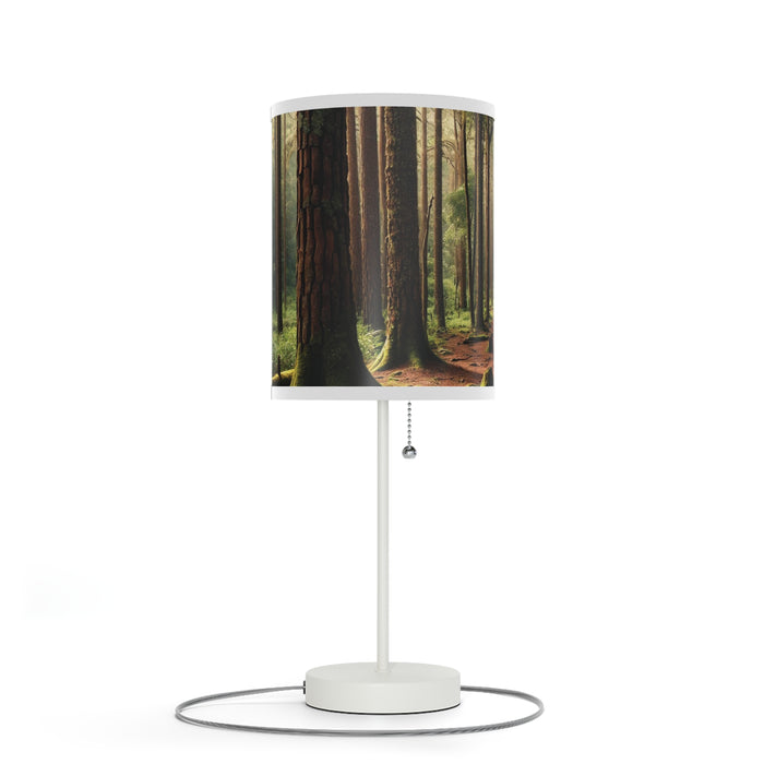 Wooded Forest Decorative Table Lamp with a cylindrical shade displays tall trees and sunlight filtering through leaves.