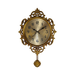 Decorative gold wall clock with intricate designs on a white background