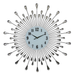 Decorative wall clock with sunburst design on a white background