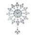 Decorative wall clock with a floral design on a white background