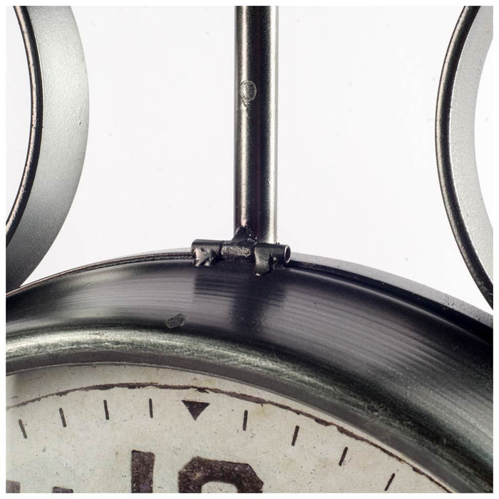 Close-up of an old-fashioned clock with a metallic finish.