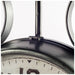 Close-up of an old-fashioned clock with a metallic finish.