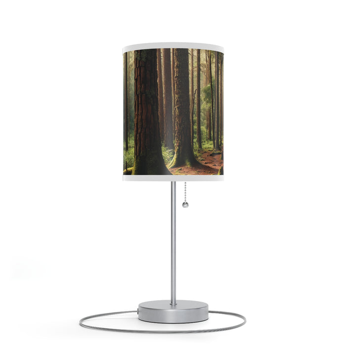 The Wooded Forest Decorative Table Lamp features a lampshade depicting tall trees and sunlight filtering through the canopy.