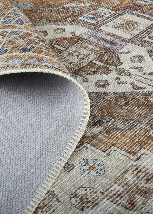 Close-up of a patterned rug with a textured border