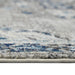Close-up of a textured rug with blue and gray patterns
