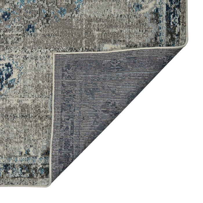 Close-up of a patterned rug with a white background