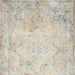 Decorative rug with intricate pattern in beige, blue, and brown tones