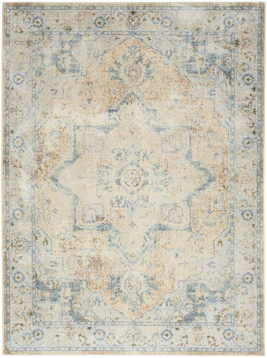 Decorative rug with intricate patterns in beige, blue, and brown on a light background