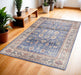 Decorative blue rug on a wooden floor with potted plants and a wooden bench.