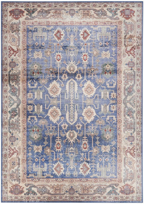 Decorative rug with intricate patterns in blue, beige, and red on a white background