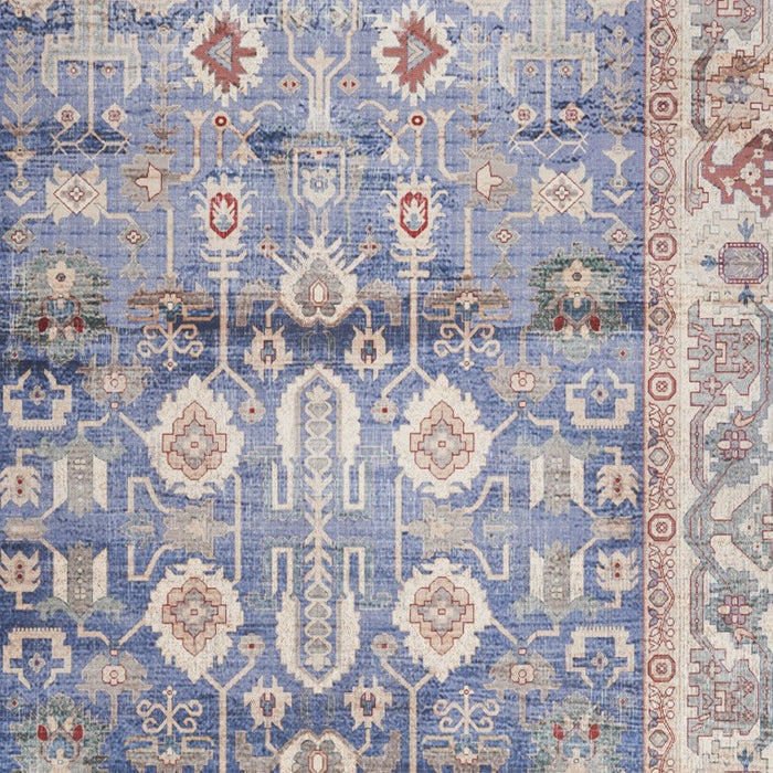 Patterned rug with blue, beige, and red colors
