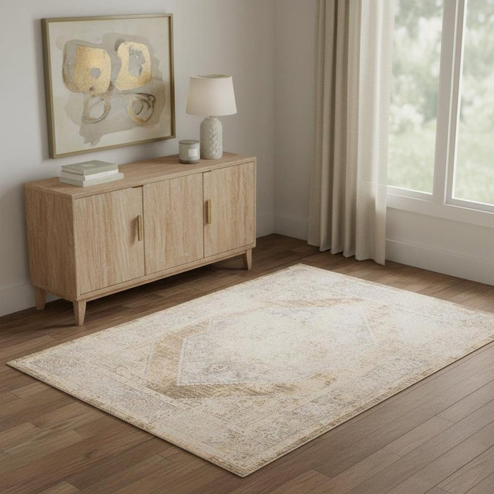 Wooden sideboard with lamp and decor items in a room with a large window and rug.