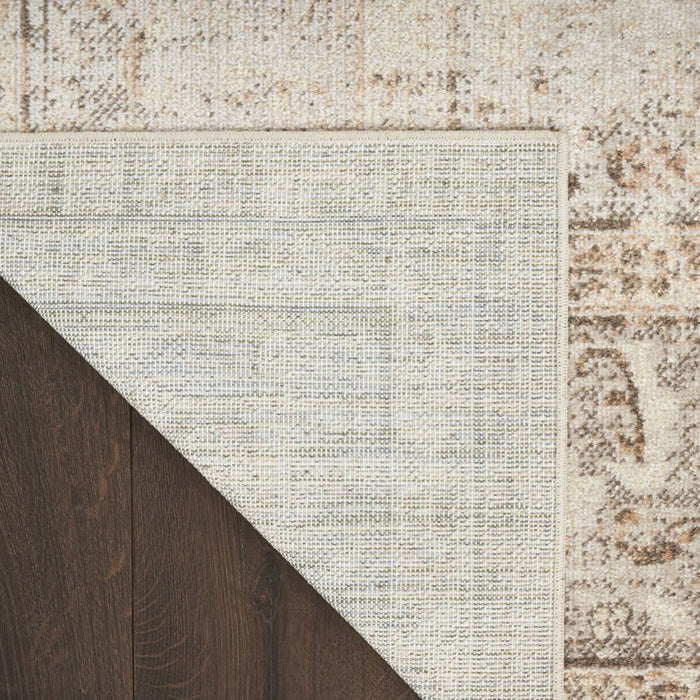 Textured rug with a geometric pattern on a wooden floor