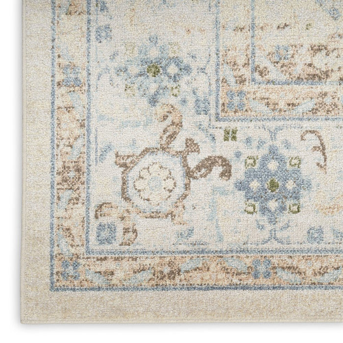 Close-up of a patterned rug with decorative elements on a white background