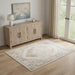 Room interior with wooden sideboard, lamp, and decorative rug.