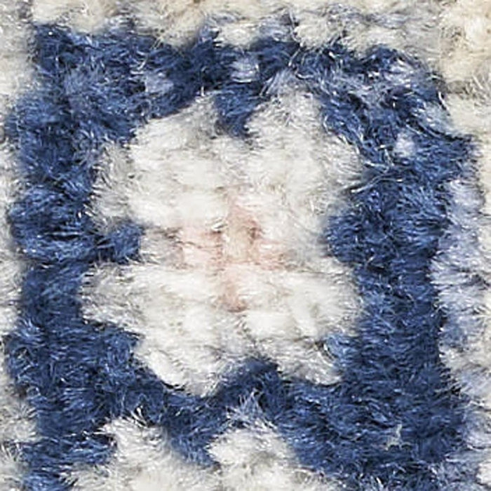 Close-up of a textured blue and white fabric surface