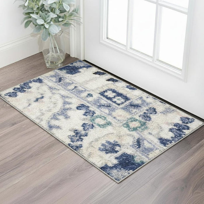 Decorative rug with blue and green pattern on a wooden floor