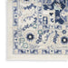 Close-up of a patterned rug with blue and beige colors on a white background