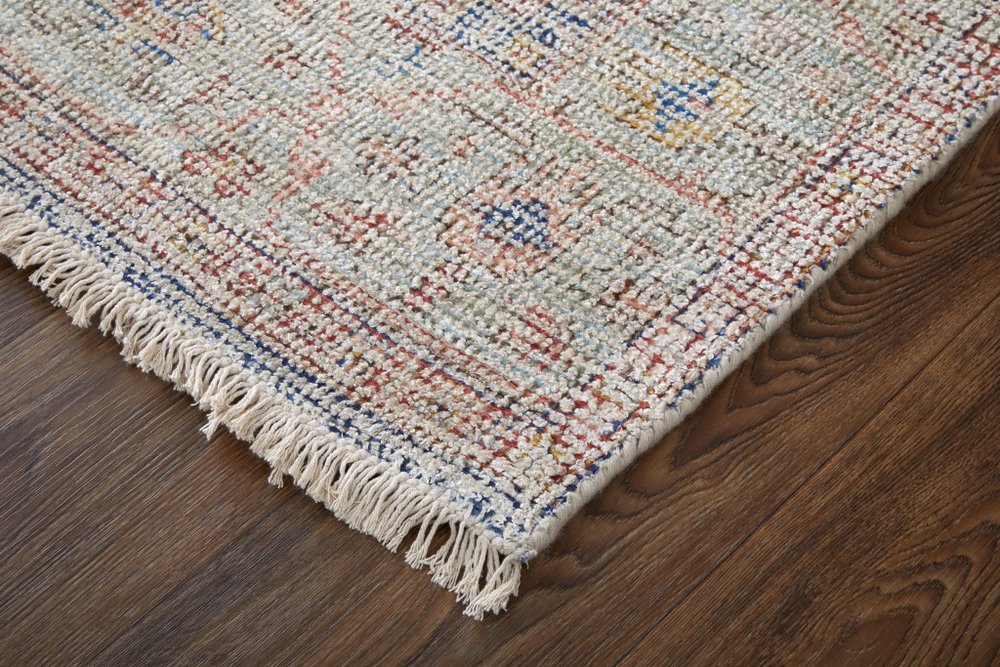 Textured area rug with colorful pattern on a wooden floor