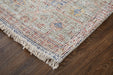 Textured area rug with colorful pattern on a wooden floor