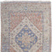 Patterned rug with blue and beige colors on a white background