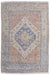 Rug with a geometric pattern featuring blue, red, and beige colors on a white background