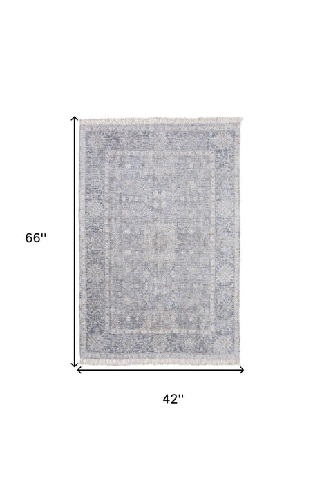 Gray area rug with dimensions 66" x 42" on a white background