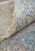 Textured rug with fringed edge and multicolor pattern