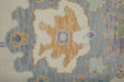Close-up of a patterned rug with floral designs in various colors.