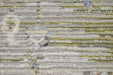 Textured fabric with a pattern of green, blue, and beige colors.