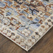 Patterned area rug on a wooden floor