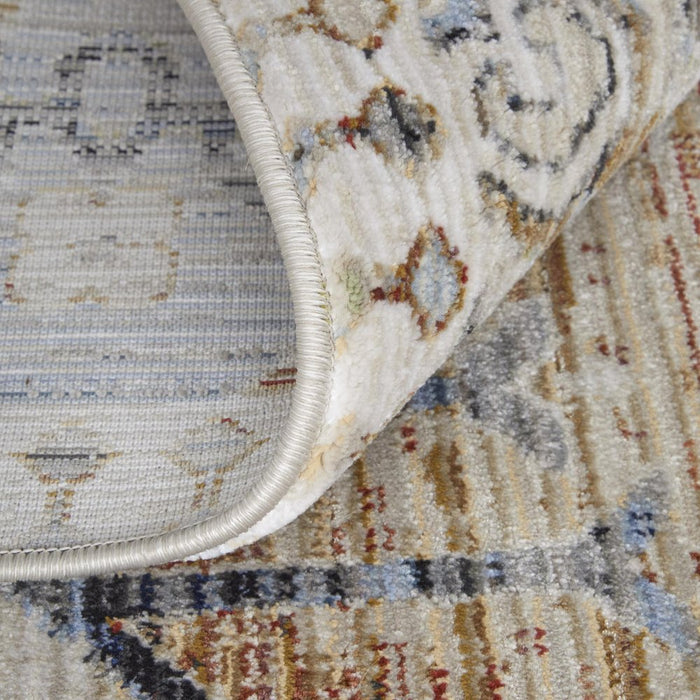 Close-up of a patterned rug with a textured border
