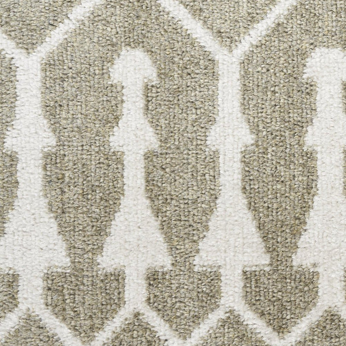 Close-up of a textured beige and white patterned carpet