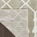 Close-up of a textured rug with geometric pattern on a wooden floor.
