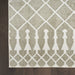 Patterned rug with geometric design on a wooden floor