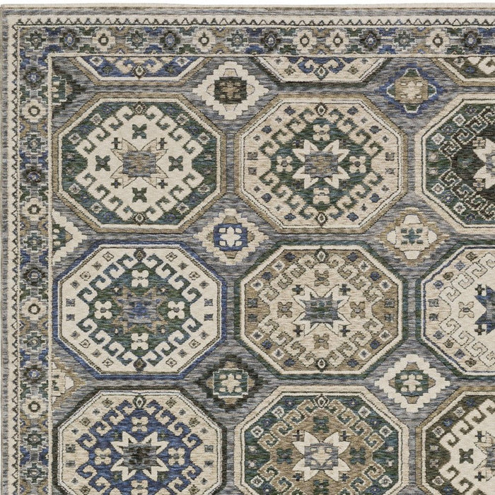 Geometric patterned rug with hexagonal designs in blue, beige, and brown.