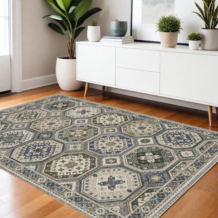 Decorative rug with geometric pattern in a room with a white sideboard and plants.
