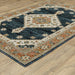 Decorative rug with geometric pattern on a wooden floor
