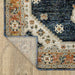 Close-up of a patterned rug on a wooden floor