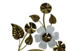 Decorative wall art with gold leaves and a white flower on a white background