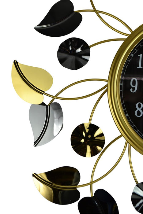 Decorative wall clock with leaf-shaped design on a white background