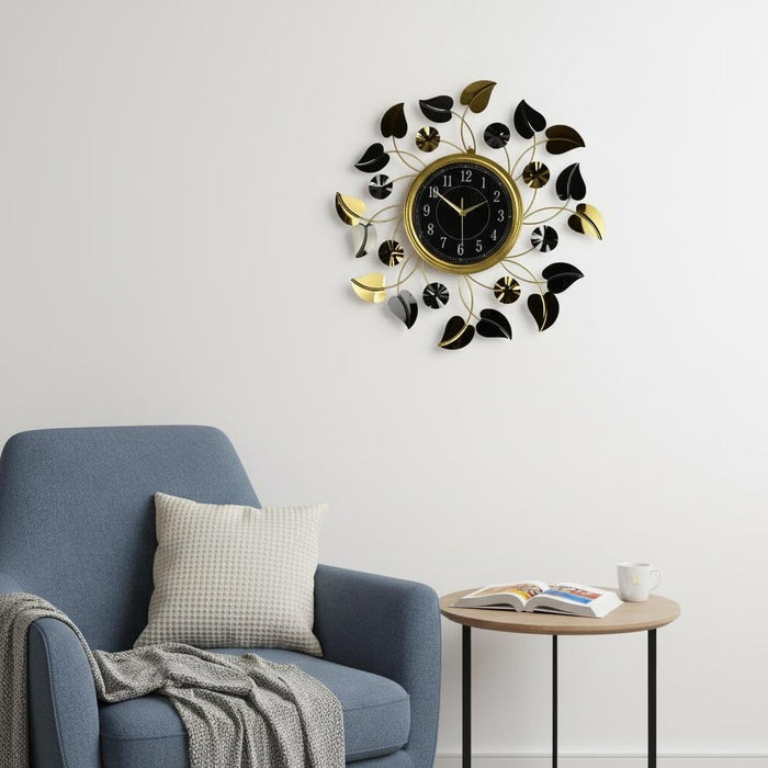 Decorative wall clock with leaf design in a living room setting