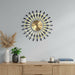 Decorative wall clock with illuminated hands on a gray wall above a wooden console table.