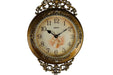 Decorative wall clock with intricate design on a white background