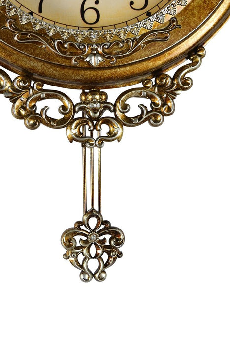 Decorative wall clock with intricate design and gold finish on a white background